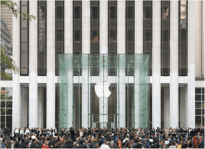 People gather around the cube on the GM Building plaza